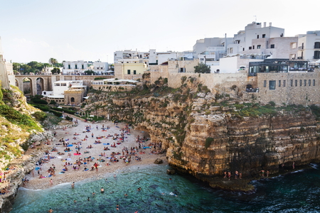People on beach Lama Monachile in Polignano a Mare, Italyのeditorial素材