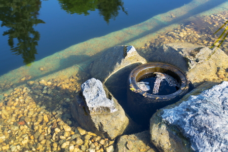 Skimmer filtering water in natural swimming pool, biologicaly filtering pondの写真素材