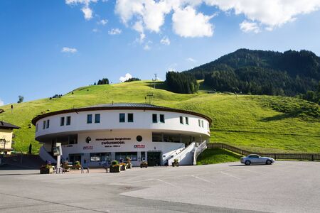 SAALBACH-HINTERGLEMM, AUSTRIA - JUNE 20 2018: Beautiful Alps Mountains landscape with Zwolferkogel cable car valley station on June 20, 2018 in Saalbach-Hinterglemm, Austria.のeditorial素材