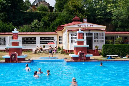 MSENO, CZECH REPUBLIC - JULY 22 2018: People swimming in art deco Mestske lazne - city baths on July 22, 2018 in Mseno, Czech Republic.のeditorial素材