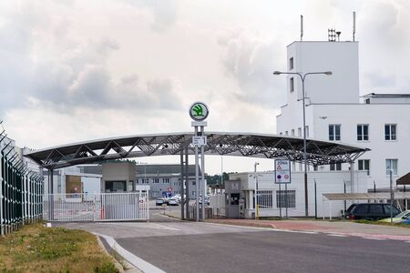 VRCHLABI, CZECH REPUBLIC - AUGUST 25 2018: Skoda Auto automobile manufacturer from Volkswagen Group company logo on plant gateway on August 25, 2018 in Vrchlabi, Czech Republic.のeditorial素材
