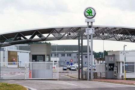 VRCHLABI, CZECH REPUBLIC - AUGUST 25 2018: Skoda Auto automobile manufacturer from Volkswagen Group company logo on plant gateway on August 25, 2018 in Vrchlabi, Czech Republic.のeditorial素材