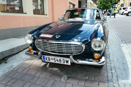 SAALBACH-HINTERGLEMM, AUSTRIA - JUNE 21 2018: Vintage car Volvo P 1800 S oldsmobile veteran produced between 1961 and 1973 stands on June 21, 2018 in Saalbach-Hinterglemm, Austria.のeditorial素材