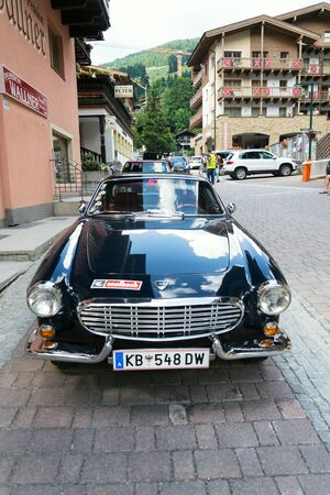 SAALBACH-HINTERGLEMM, AUSTRIA - JUNE 21 2018: Vintage car Volvo P 1800 S oldsmobile veteran produced between 1961 and 1973 stands on June 21, 2018 in Saalbach-Hinterglemm, Austria.のeditorial素材