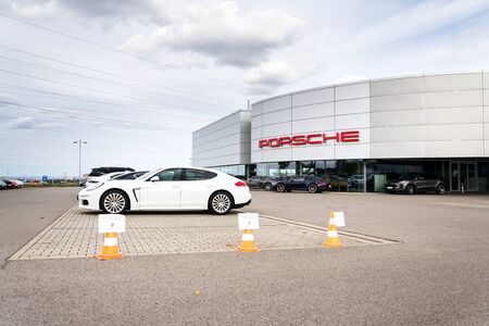 PRAGUE, CZECH REPUBLIC - SEPTEMBER 22 2018: Cars in front of Porsche automotive company dealership buildin on September 22, 2018 in Prague, Czech Republic.のeditorial素材