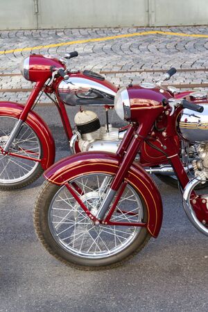 PRAGUE, CZECH REPUBLIC - MARCH 8 2018: Red vintage motorcycles Jawa 125 and Jawa 500 produced in former Czechoslovakia stand on road on March 8, 2018 in Prague, Czech Republic.のeditorial素材