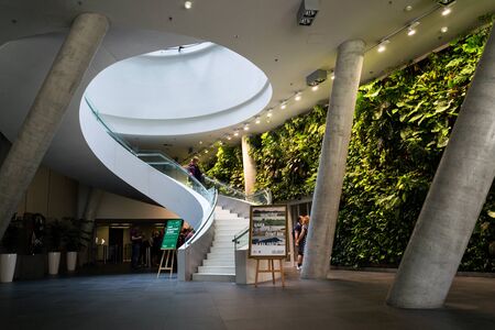 PRAGUE, CZECH REPUBLIC - MAY 19 2018: Vertical garden indoors, living green wall with flowers and plants under artificial lighting on May 19, 2018 in Prague, Czech Republic.のeditorial素材
