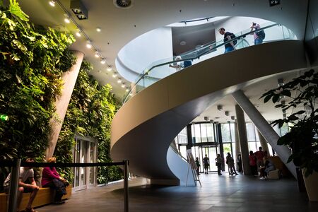 PRAGUE, CZECH REPUBLIC - MAY 19 2018: Vertical garden indoors, living green wall with flowers and plants under artificial lighting on May 19, 2018 in Prague, Czech Republic.のeditorial素材