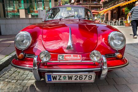 SAALBACH-HINTERGLEMM, AUSTRIA - JUNE 21 2018: Red Porsche 356 oldsmobile vintage veteran car detail...