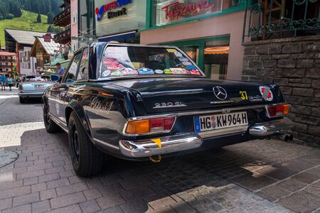 SAALBACH-HINTERGLEMM, AUSTRIA - JUNE 21 2018: Vintage dark blue Mercedes-Benz 230 SL oldsmobile veteran car standing on street on June 21, 2018 in Saalbach-Hinterglemm, Austria.のeditorial素材