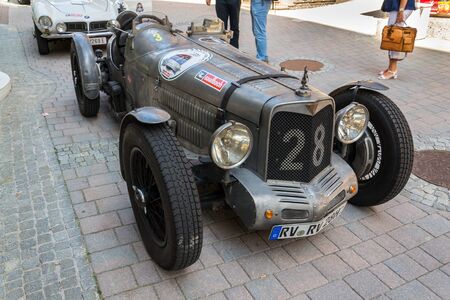 SAALBACH-HINTERGLEMM, AUSTRIA - JUNE 21 2018: Vintage Alvis oldsmobile veteran car standing on street on June 21, 2018 in Saalbach-Hinterglemm, Austria.のeditorial素材