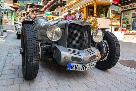 SAALBACH-HINTERGLEMM, AUSTRIA - JUNE 21 2018: Vintage Alvis oldsmobile veteran car standing on street on June 21, 2018 in Saalbach-Hinterglemm, Austria.のeditorial素材