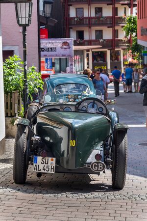 SAALBACH-HINTERGLEMM, AUSTRIA - JUNE 21 2018: Vintage Alvis oldsmobile veteran car standing on street on June 21, 2018 in Saalbach-Hinterglemm, Austria.のeditorial素材