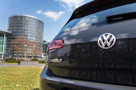 DRESDEN, GERMANY - APRIL 2 2018: Plug-in hybrid Volkswagen e-Golf electric car stands in front of...