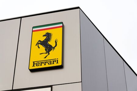 PRAGUE, CZECH REPUBLIC - DECEMBER 23 2018: Ferrari N. V. italian luxury sports car manufacturer company logo in front of dealership building on December 23, 2018 in Prague, Czech Republic.のeditorial素材