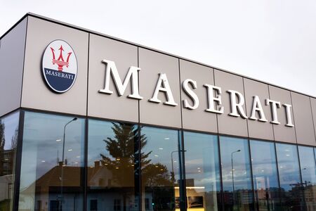 PRAGUE, CZECH REPUBLIC - DECEMBER 23 2018: Maserati Italian luxury car manufacturer company logo in front of dealership building on December 23, 2018 in Prague, Czech Republic.のeditorial素材