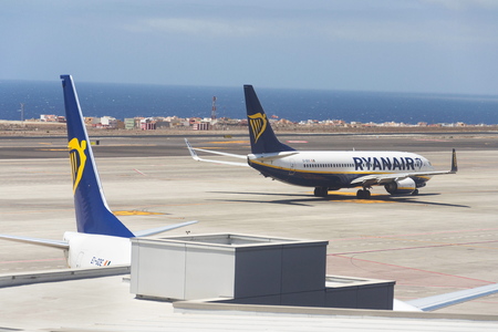 GRANADILLA DE ABONA, SPAIN - JULY 13 2019: Ryanair Irish low-cost airline Boeing 737 preparing for flight on airport runway on July 13, 2019 in Granadilla de Abona, Spain.のeditorial素材