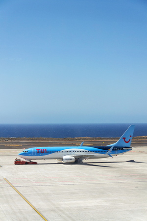 GRANADILLA DE ABONA, SPAIN - JULY 13 2019: TUI Airway charter airline Boeing 737-800 airplane preparing for flight on airport runway on July 13, 2019 in Granadilla de Abona, Spain.のeditorial素材