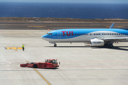 GRANADILLA DE ABONA, SPAIN - JULY 13 2019: TUI Airway charter airline Boeing 737-800 airplane preparing for flight on airport runway on July 13, 2019 in Granadilla de Abona, Spain.のeditorial素材
