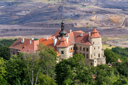 Jezeri Castle with Czechoslovak army coal mine in background, Horni Jiretin, Most district, Ustecky region, Czech Republic, sunny summer dayのeditorial素材
