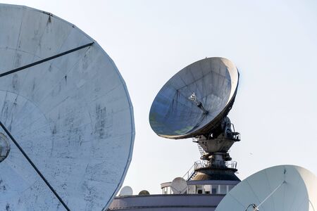 Radar antenna on satellite links center, telecommunication tower, wireless communication concept,...