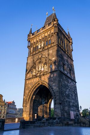 Old Town Bridge Tower guarding end of the Charles Bridge and entrance to Old Town of Prague, Czech Republic, sunny summer morningの写真素材