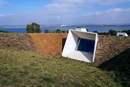 Concrete parts of Pavlov Archaeological park building on banks of Nove Mlyny water reservoir near Devicky castle ruins, South Moravia, Czech Republic, sunny summer dayの写真素材