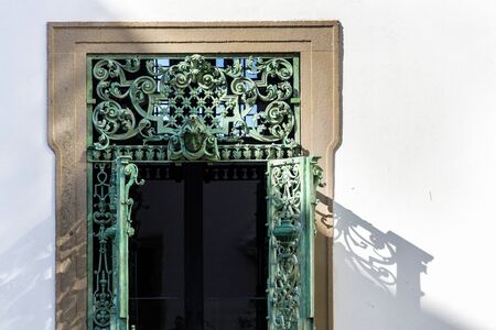 Decorative metal lattice doors at the Mikulov Castle in South Moravia, Czech Republic, sunny summer dayの写真素材