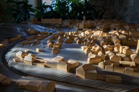 Model of town built from wooden building blocks, housing and urban development concept  の写真素材