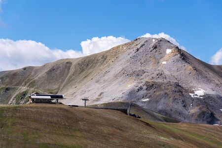 Mountains of Livigno Alps on the border between Italy and Switzerland, view from Lac Salin cable car station, sunny summer day, Italyの写真素材