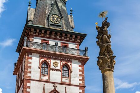 Sightseeing tower of the late gothic decanal Church of the Assumption of the Virgin Mary in Chomutov, Usti nad Labem region, Krusne hory, Ore Mountains, Czech Republic, sunny summer day, clear blue sky backgroundの写真素材