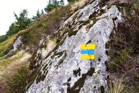 Blue and yellow square hiking markers, trail blazing symbol, Krkonose mountains, Czech Republicの写真素材