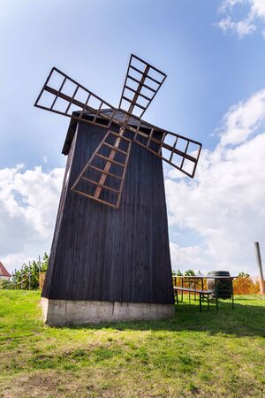 Traditional wooden windmill, Vrbice, Breclav district, Southern Moravia, Czech Republic, sunny summer dayの写真素材
