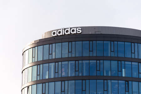PRAGUE, CZECH REPUBLIC - MARCH 5 2020: Sportswear manufacturer Adidas company logo on headquarters buildign on March 5, 2020 in Prague, Czech Republic.のeditorial素材