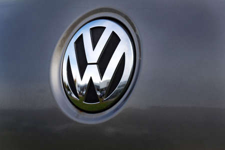 PRAGUE, CZECH REPUBLIC - OCTOBER 25 2017: Silver Volkswagen company logo on grey car on October 25, 2017 in Prague, Czech Republic.のeditorial素材