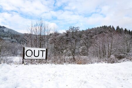 Out sign in snowy landscape, lonely walk in natuer, active lifestyle change concept, mind body soul improvement, winter dayの写真素材