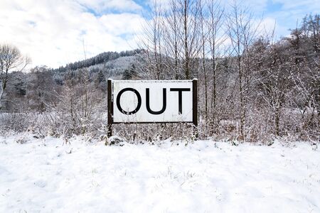Out sign in snowy landscape, lonely walk in natuer, active lifestyle change concept, mind body soul improvement, winter dayの写真素材