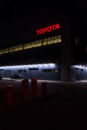 PRAGUE, CZECH REPUBLIC - APRIL 3 2020: Toyota motor company logo on dealership building at night on April 3, 2020 in Prague, Czech Republic.のeditorial素材