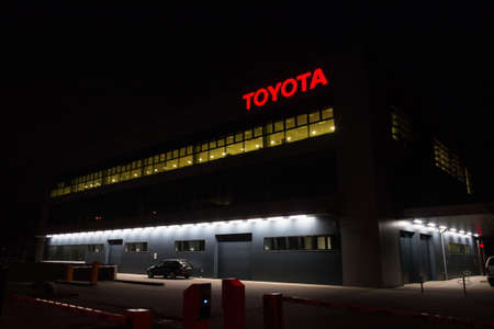 PRAGUE, CZECH REPUBLIC - APRIL 3 2020: Toyota motor company logo on dealership building at night on April 3, 2020 in Prague, Czech Republic.のeditorial素材