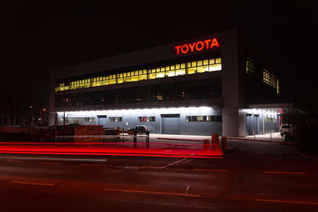 PRAGUE, CZECH REPUBLIC - APRIL 3 2020: Toyota motor company logo on dealership building at night on April 3, 2020 in Prague, Czech Republic.のeditorial素材
