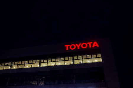PRAGUE, CZECH REPUBLIC - APRIL 3 2020: Toyota motor company logo on dealership building at night on April 3, 2020 in Prague, Czech Republic.のeditorial素材