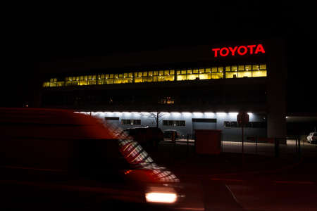 PRAGUE, CZECH REPUBLIC - APRIL 3 2020: Toyota motor company logo on dealership building at night on April 3, 2020 in Prague, Czech Republic.のeditorial素材