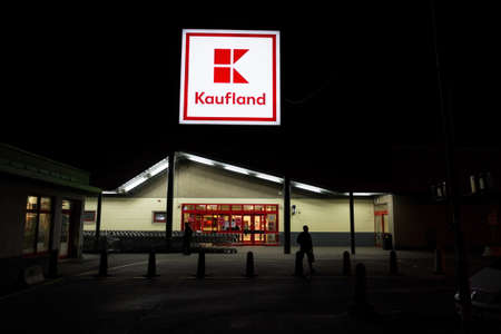 PRAGUE, CZECH REPUBLIC - APRIL 3 2020: Kaufland company logo at night on supermarket building from German chain, part of Schwartz Gruppe on April 3, 2020 in Prague, Czech Republic.のeditorial素材