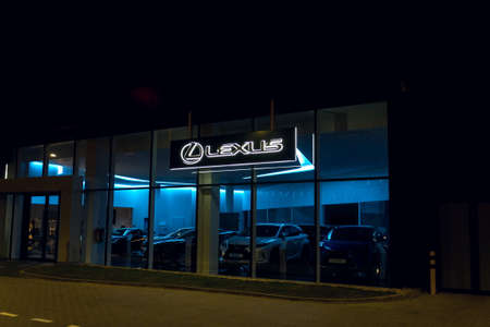 PRAGUE, CZECH REPUBLIC - APRIL 3 2020: Lexus company logo on dealership building, luxury vehicle division of Japanese automaker Toyota at night on April 3, 2020 in Prague, Czech Republic.のeditorial素材