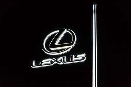 PRAGUE, CZECH REPUBLIC - APRIL 3 2020: Lexus company logo on dealership building, luxury vehicle division of Japanese automaker Toyota at night on April 3, 2020 in Prague, Czech Republic.のeditorial素材