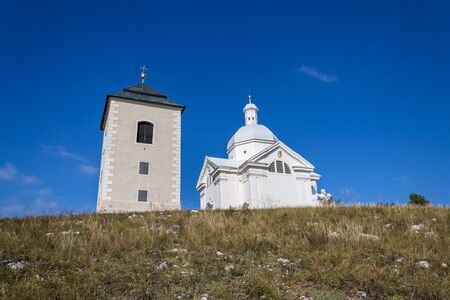 Nature preserve Holy Hill by Mikulov with Way of the Cross to the Pilgrimage Chapel of Saint Sebastian and Bell Tower, Moravia, Czech Republic, sunny summer dayの写真素材