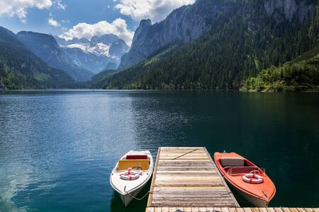 Vorderer Gosausee lake near Gosau with melting glacier in background, Austria, sunny summer dayの写真素材