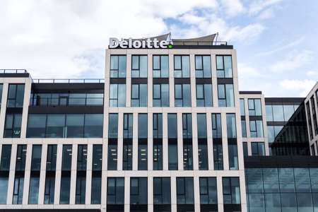 PRAGUE, CZECH REPUBLIC - APRIL 30 2020: Deloitte professional service company network logo on the building of the Czech headquarters on April 30, 2020 in Prague, Czech Republic.のeditorial素材