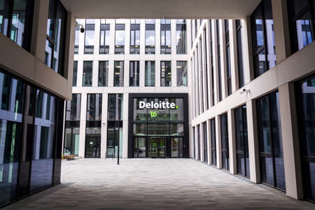 PRAGUE, CZECH REPUBLIC - APRIL 30 2020: Deloitte professional service company network logo on the building of the Czech headquarters on April 30, 2020 in Prague, Czech Republic.のeditorial素材