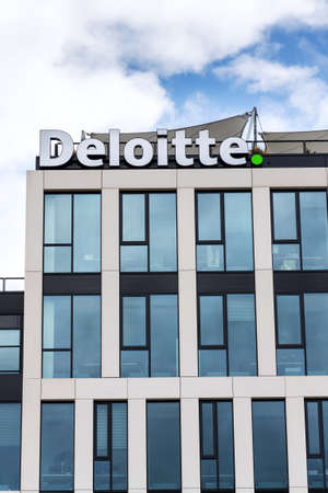 PRAGUE, CZECH REPUBLIC - APRIL 30 2020: Deloitte professional service company network logo on the building of the Czech headquarters on April 30, 2020 in Prague, Czech Republic.のeditorial素材